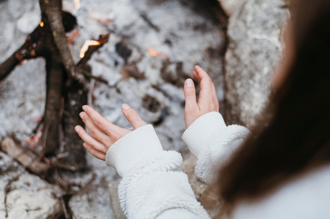 Woman warming up her hands.